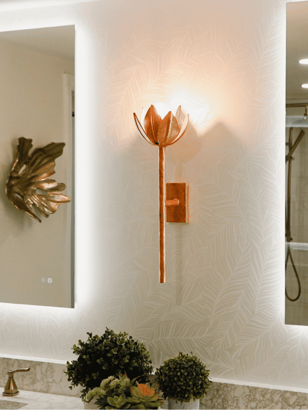 Luxurious bathroom with illuminated backlit mirrors, modern fixtures, and elegant decor showcasing high-end design and build by Aurea Kitchens.