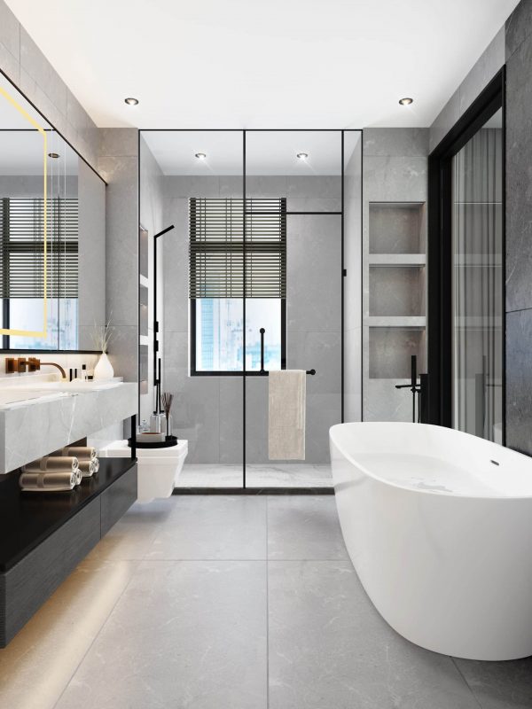 Contemporary modern bathroom with freestanding bathtub, walk-in shower, and sleek design, featuring grey tiles, black fixtures, and large windows; designed by Aurea Kitchens for luxury living.