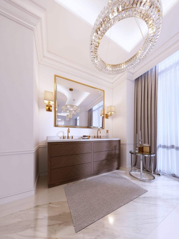 Luxury bathroom vanity with dual gold faucets, large mirror, elegant lighting, and sophisticated decor in a modern upscale interior.